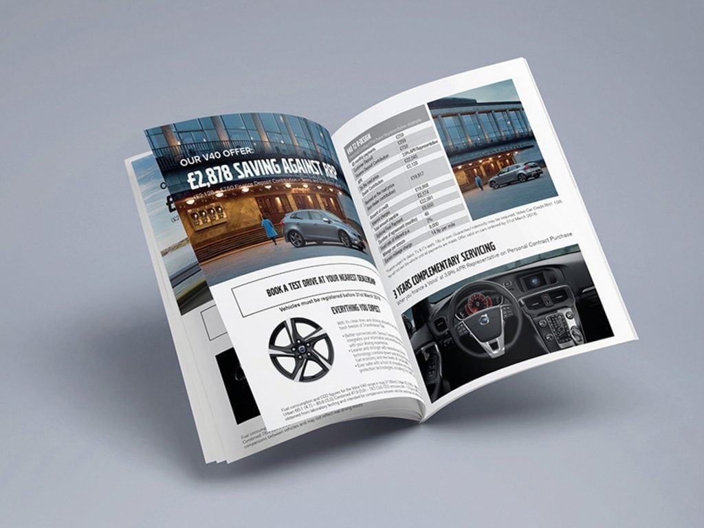 Open Volvo brochure showing clean automotive layout and high-end design spread with vehicle imagery and technical content.